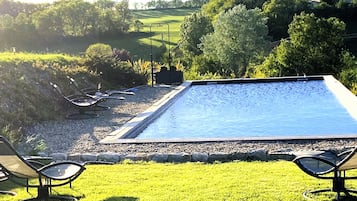 Seasonal outdoor pool, open 8:00 AM to 11:00 PM, sun loungers