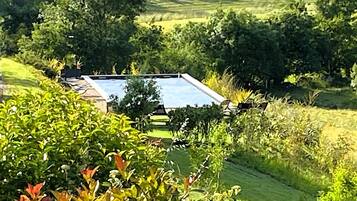Seasonal outdoor pool, open 8:00 AM to 11:00 PM, sun loungers