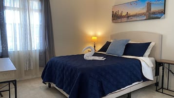 1 bedroom, desk, iron/ironing board, travel crib