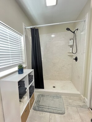 Shower, hair dryer, towels, soap