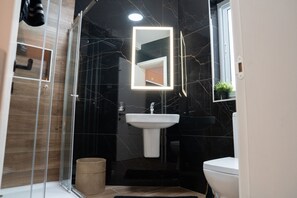 Bathtub, hair dryer, towels, soap
