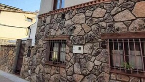 A building with a stone facade and a flat roof.