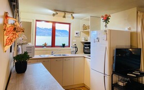 Fridge, microwave, stovetop, coffee/tea maker