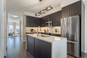 Fridge, microwave, oven, stovetop - Sunrises Near DT & Stampede 2 BR 2 BA w AC (Calgary)