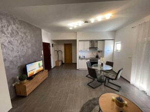Apartment, Mehrere Betten | Wohnzimmer