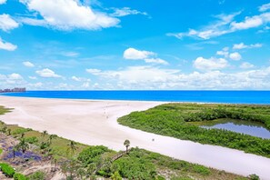Overlooking a serene coastal landscape, this property offers breathtaking views of the ocean and surrounding greenery.