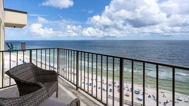 A balcony with a view of a beach and ocean. - Phoenix I 1151 by Liquid Life (Orange Beach)