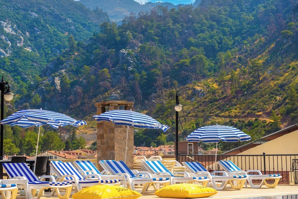 Seasonal outdoor pool, open 9:00 AM to 7:30 PM, pool umbrellas