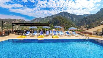 Seasonal outdoor pool, open 9:00 AM to 7:30 PM, pool umbrellas