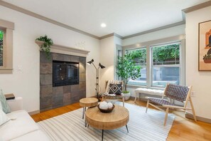 TV, fireplace, Netflix, streaming services - Perch - City Oasis: Spacious, Cozy Home w/ Parking & Sunroom (Seattle)