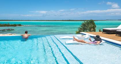 Luxury beachfront villa with dock and a private large heated pool. For 10 people