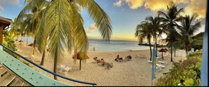 Relax on the beach with stunning ocean views and comfortable sun loungers.