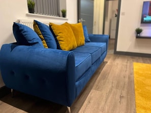 Apartamento, 2 camas Queen | Sala de estar