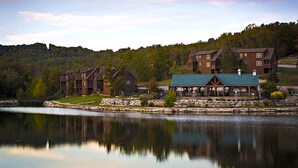 A lakeside lodge with multiple buildings, a dock, and a gazebo. - Perfect for Family Reunions & Large Groups! 3 Pools - Games - Golf - Firepit! (Branson West)