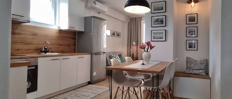 Fridge, toaster, cookware/dishes/utensils, paper towels