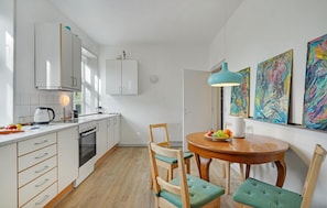 Fridge, stovetop, dishwasher, coffee/tea maker