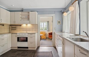 Fridge, stovetop, dishwasher, coffee/tea maker
