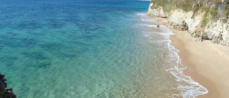On the beach, sun-loungers, beach towels