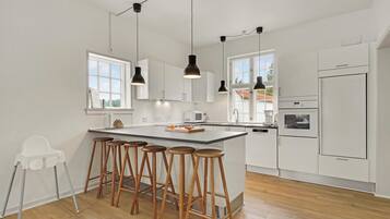 Fridge, stovetop, dishwasher, coffee/tea maker