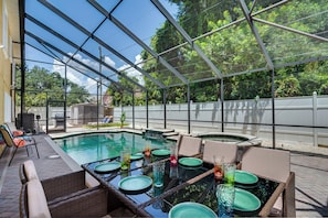 Outdoor pool, a heated pool - Luxury 5 Bedroom Dunedin home ~ TWO full kitchens, heated pool, hot tub! (Dunedin)