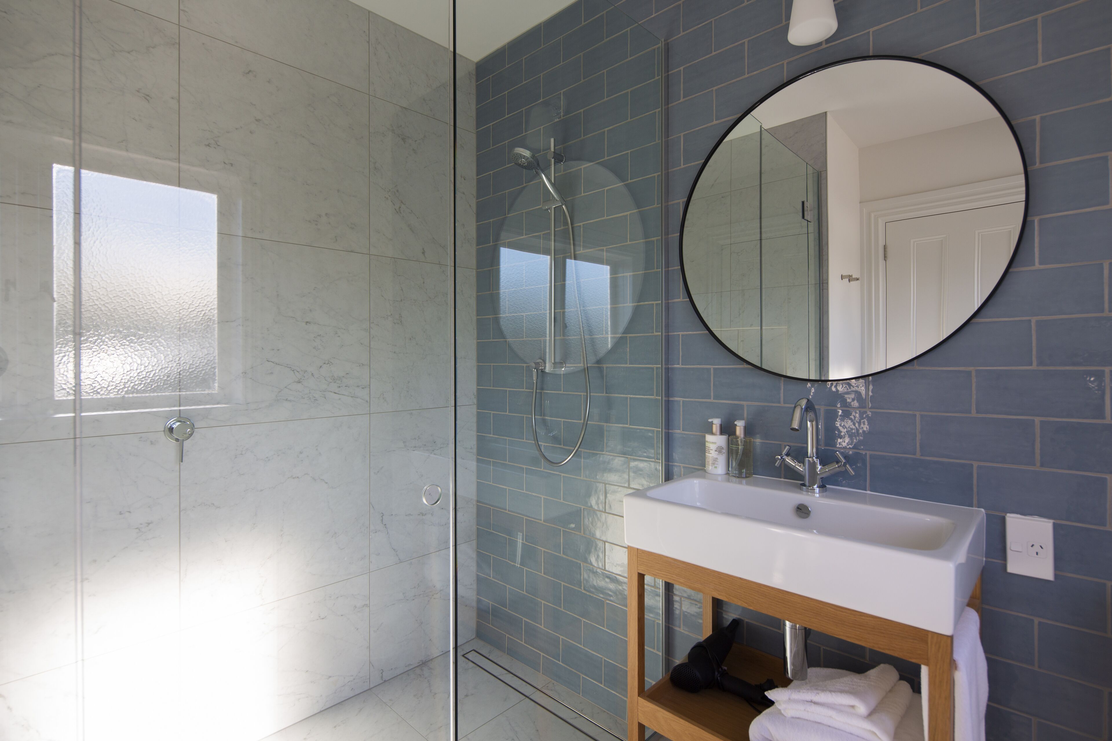 Shower, designer toiletries, hair dryer, bathrobes