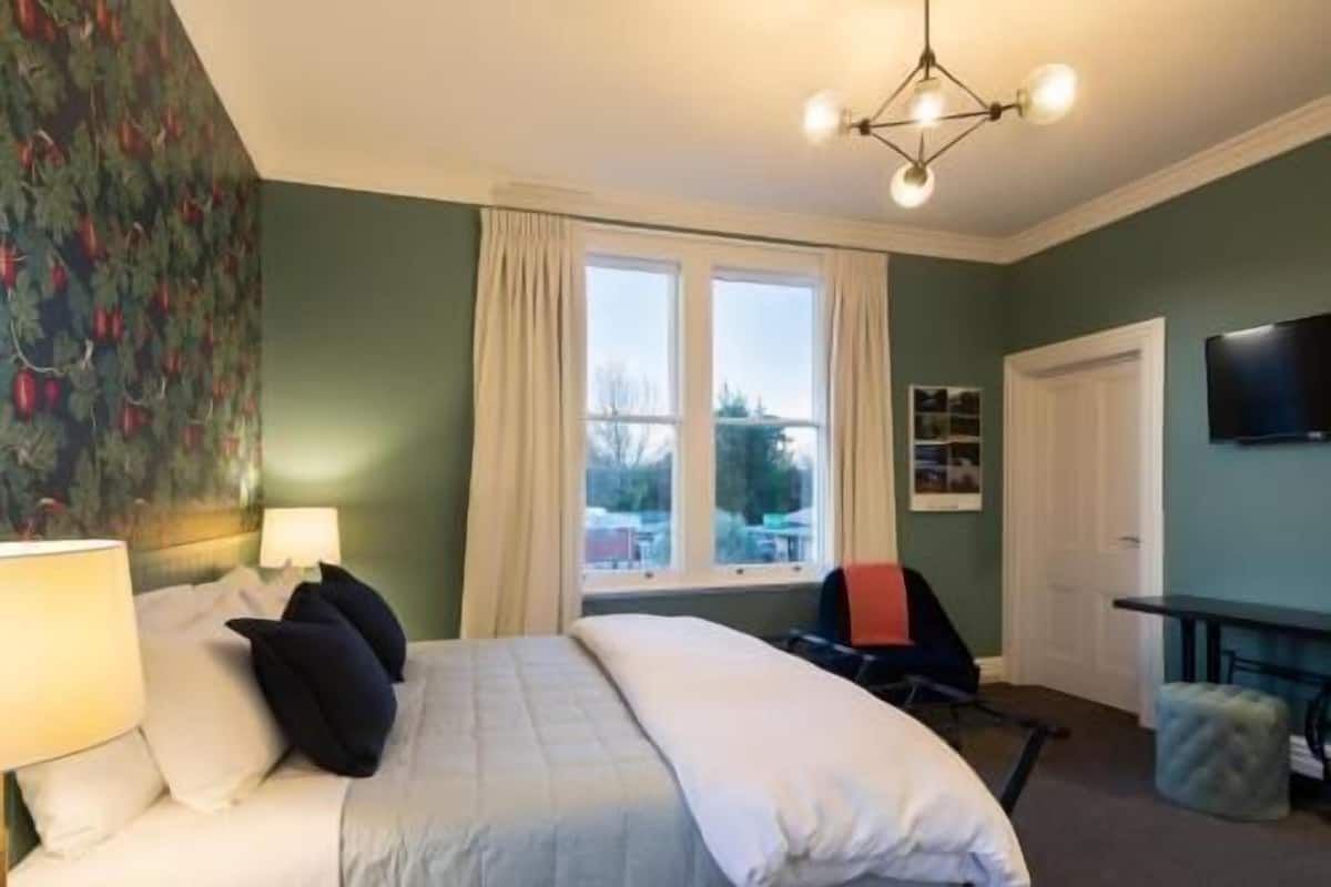Premium bedding, desk, laptop workspace, soundproofing