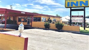 A CHILDRENS INN with a clear sign, large clean rooms, and reasonable rates.