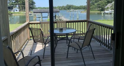 Spacious waterfront home with dock and sunset view