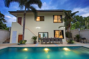A two-story house with a swimming pool, outdoor seating, and palm trees. - Tropical Vibe 5BR Pool Villa Nikkie 3 (Rawai)