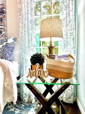 Relax in comfort with a cozy atmosphere, a glass-top table, and a soothing view.