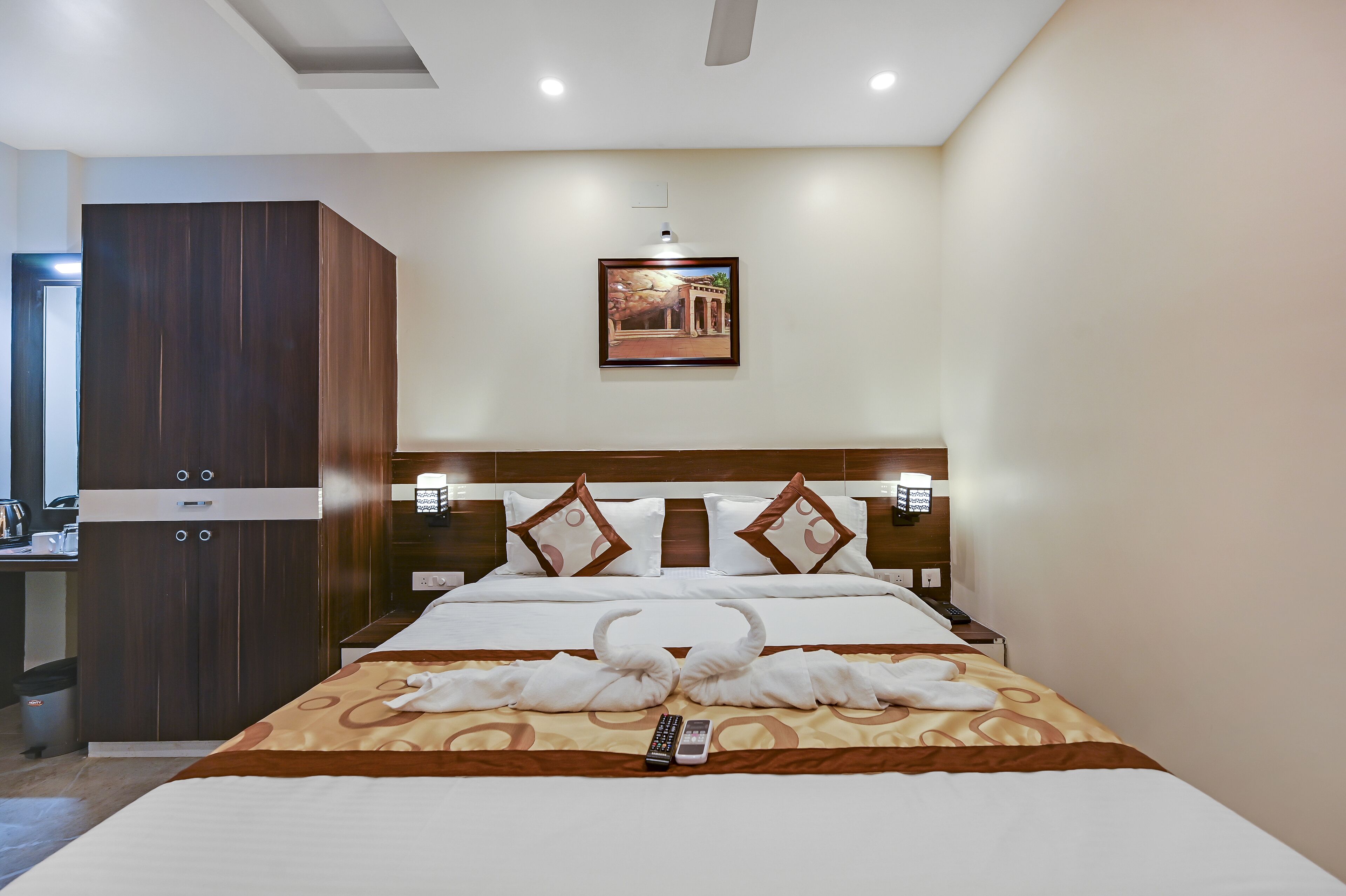 desk, laptop workspace, bed sheets