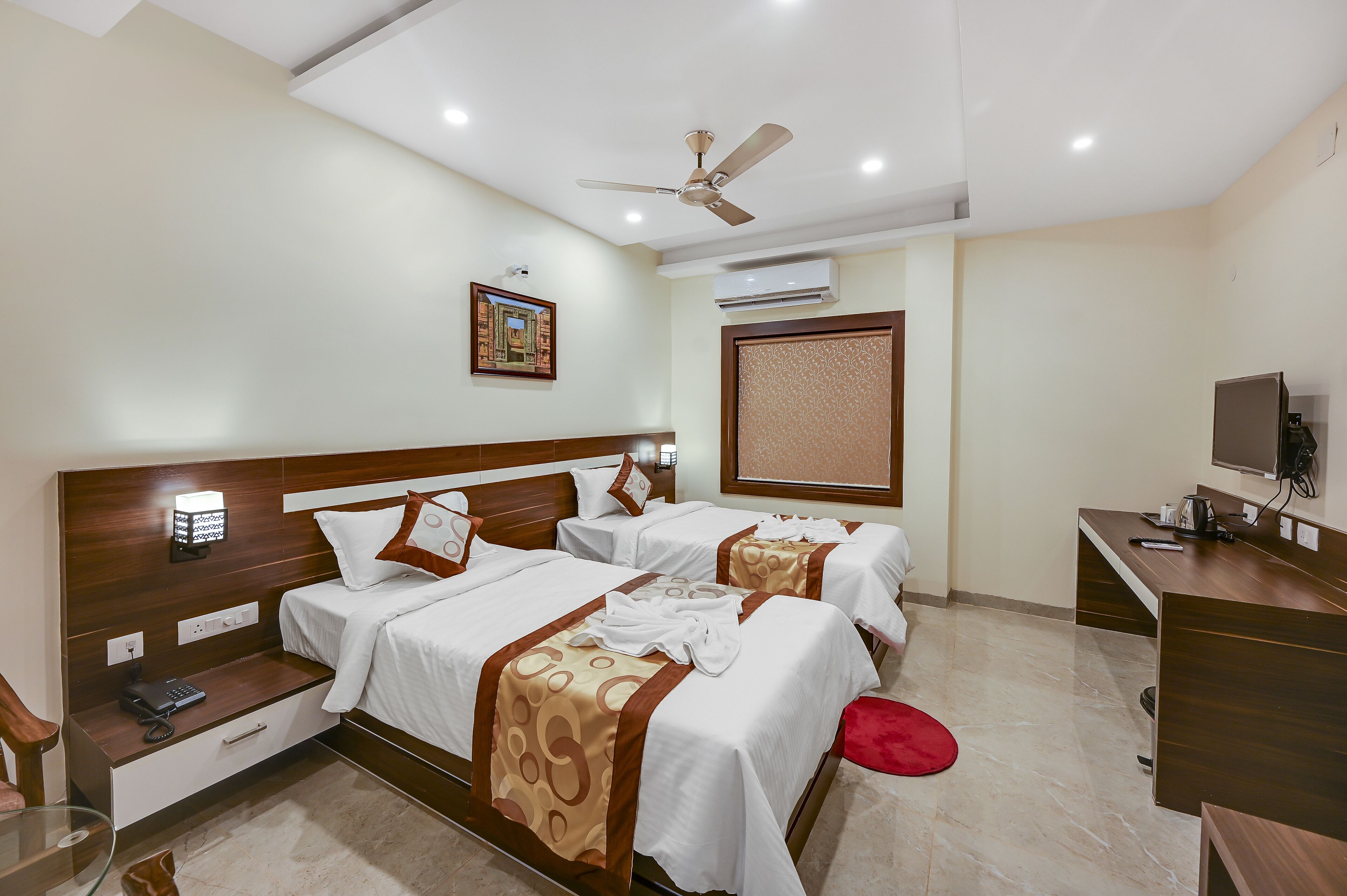 desk, laptop workspace, bed sheets