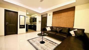 Executive Apartment | Living area | 32-inch LED TV with cable channels, TV