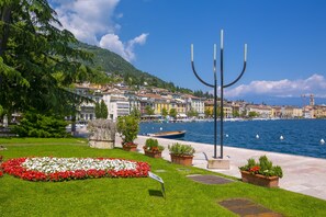 Stroll along the serene riverside promenade with a picturesque view of the historic town.