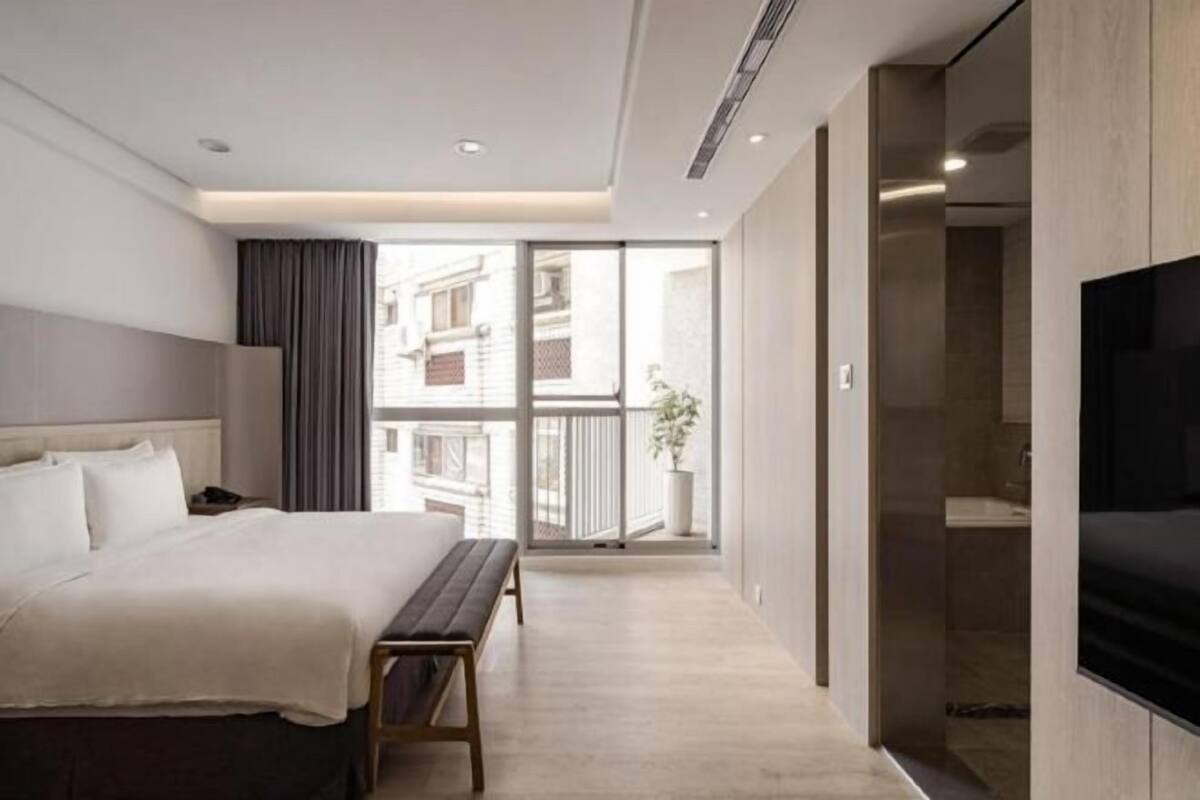 Premium bedding, desk, laptop workspace, blackout curtains