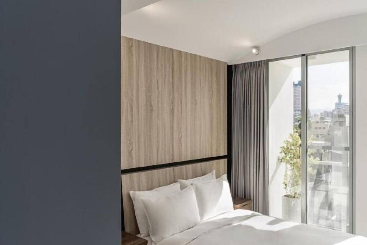 Premium bedding, desk, laptop workspace, blackout curtains