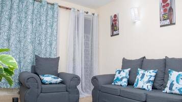 Business Apartment | Living area | 24-inch Smart TV with digital channels, TV