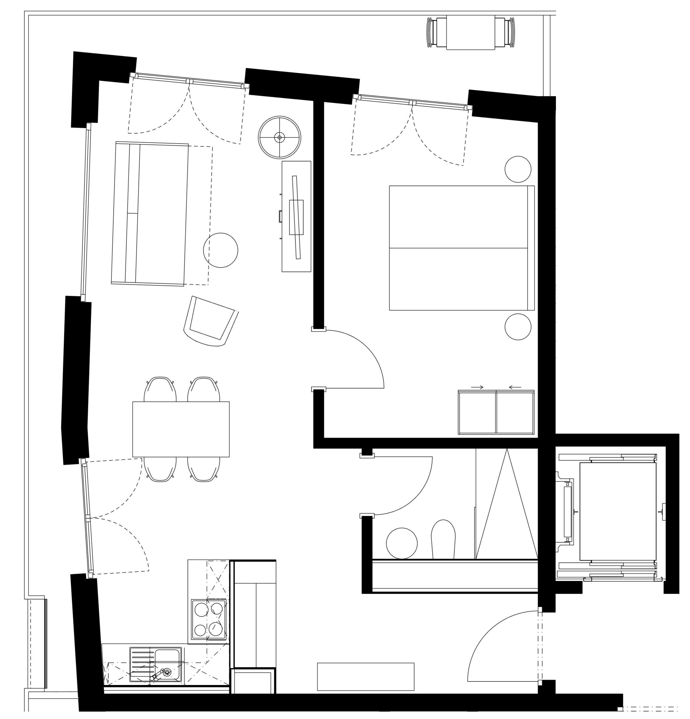 A floor plan with a kitchen, dining area, and a large bedroom.