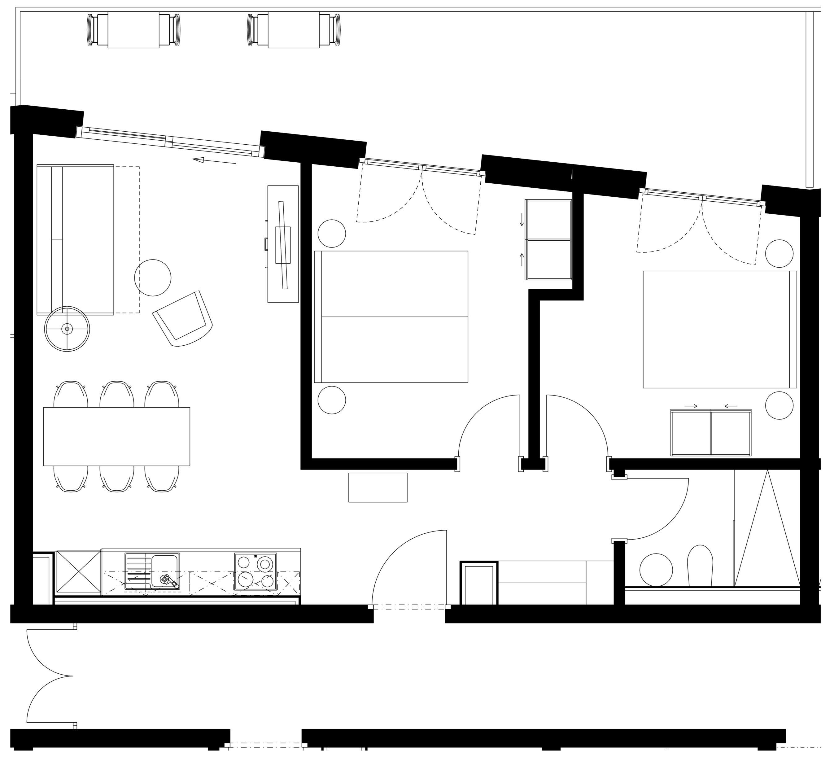 Plano de planta que muestra una cocina, comedor, dos dormitorios y un baño.