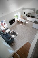Executive Apartment | Living area | 50-inch Smart TV with digital channels, TV, heated floors