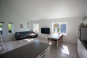 Apartamento executivo | Área de estar | Smart TV 50 polegadas com canais digitais, TV, pisos aquecidos