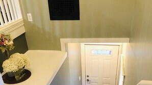 A staircase with a carpeted landing and a door at the top. - Cute cozy apartment. Half a block walking distance from beautiful downtown Ionia (Ionia)