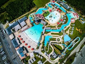 An aerial view of a water park with multiple slides and pools.