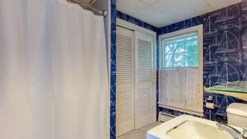 Combined shower/tub, hair dryer, towels, soap