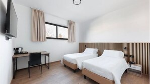 A modern hotel room with two single beds, a desk with a chair, a flat-screen TV, and a window with curtains. - Moon Palace Hotel  (Arese)