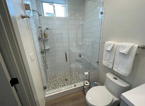 Shower, hair dryer, towels, soap