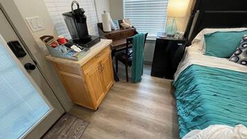 1 bedroom, desk, iron/ironing board, travel crib