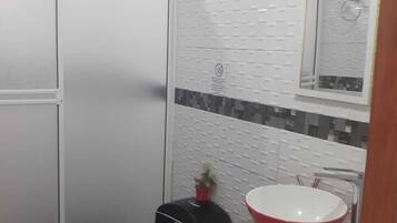 Bathtub, towels, soap, toilet paper