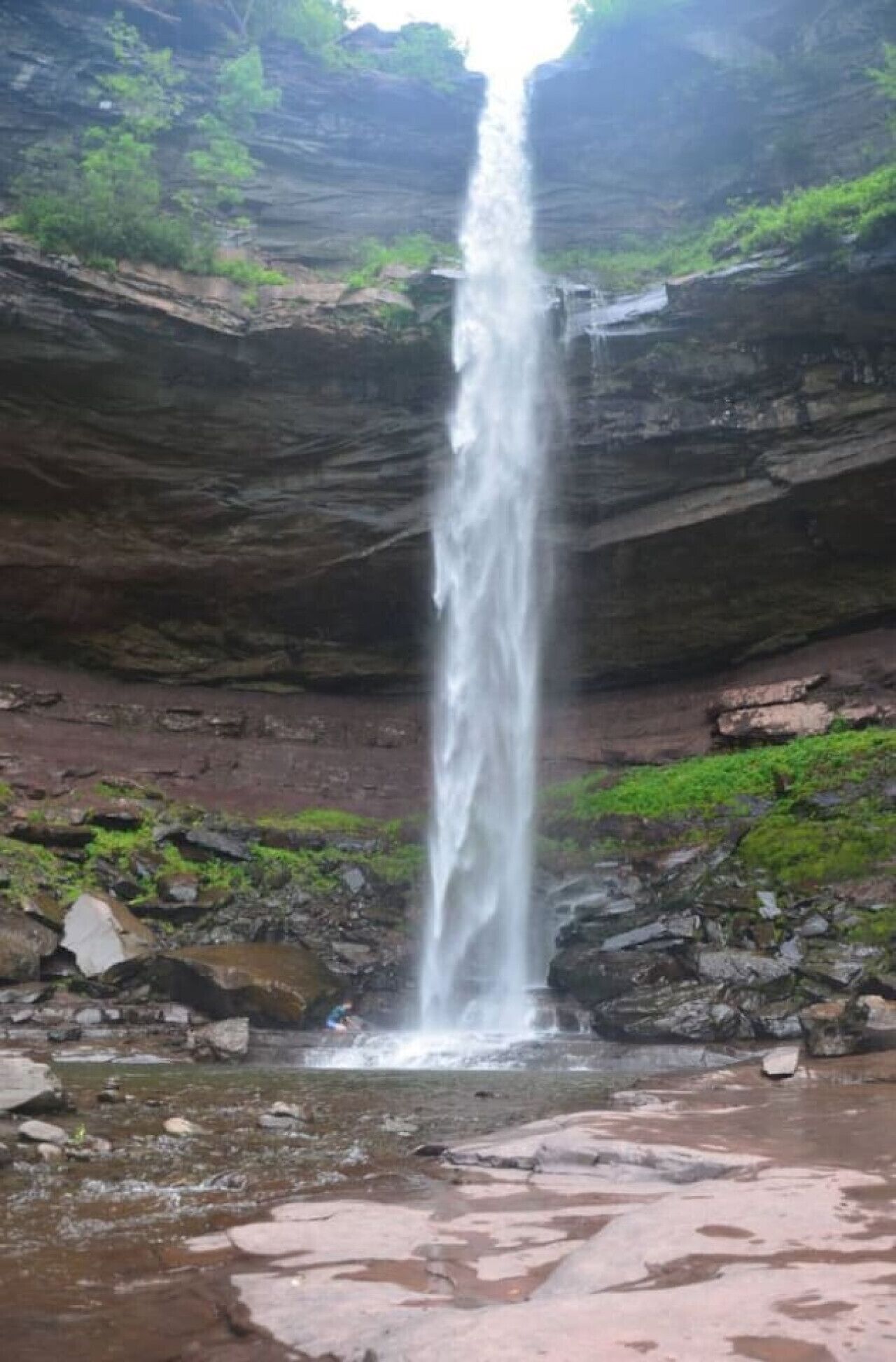 A waterfall cascading down a rocky cliff.