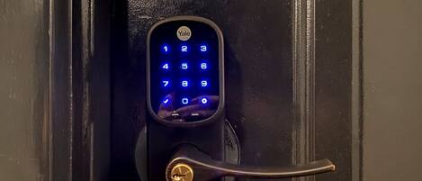 A Yale smart lock installed on a door.
